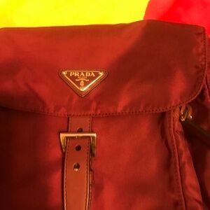 Authentic prada sling bag,.just lost the small pocket /small  purse at sling